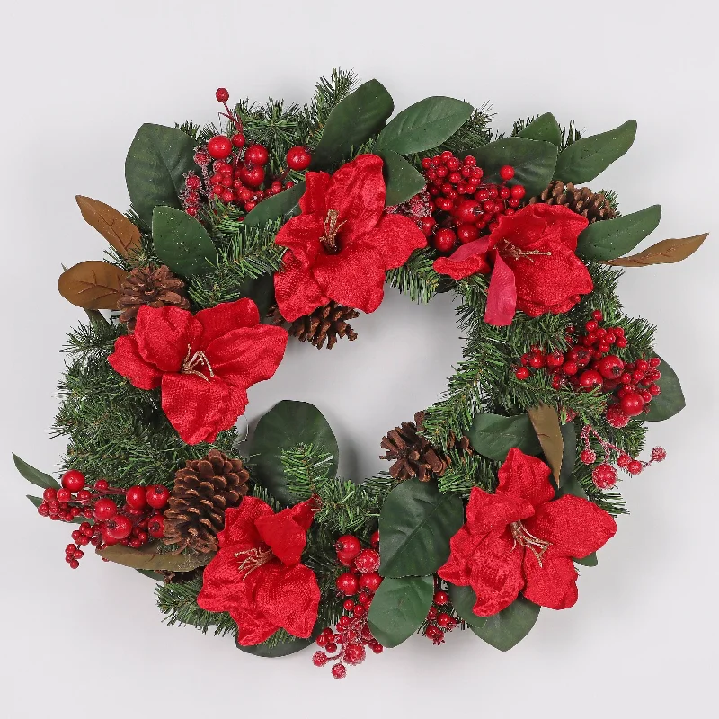 Wreath with poinsettia, large pinecones and frosted berries