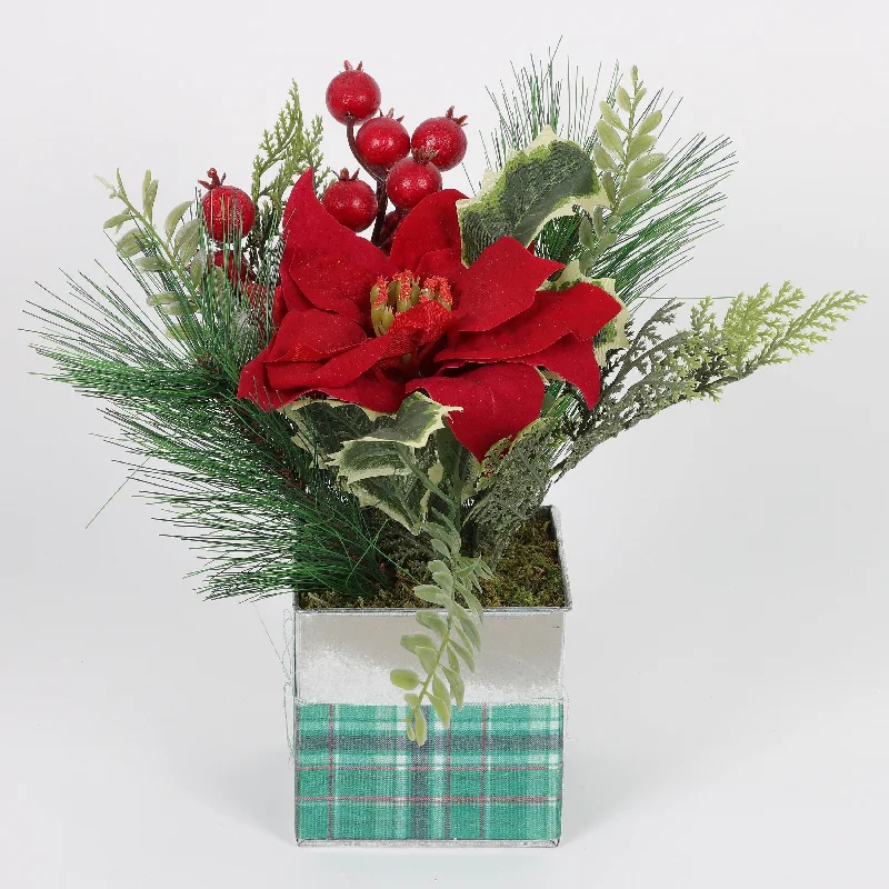 Metal pot with decorative Christmas floral arrangements